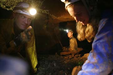 Hans Bluedorn talking with Johannah Bluedorn on ledge in Mushroom Cave