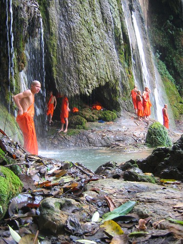 monks in waterfall