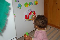 Julia discpvers the fridge toys