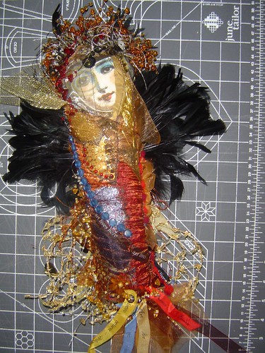 front of winged doll