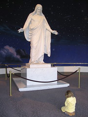 Girl praying at the Christus