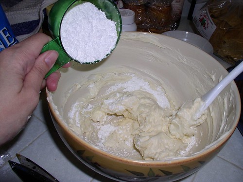 mixing the butter cream-cheese frosting