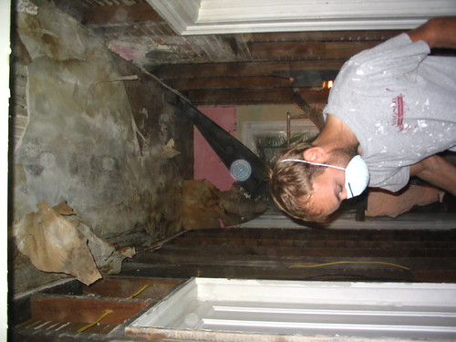 Demolishing the hallway ceiling.