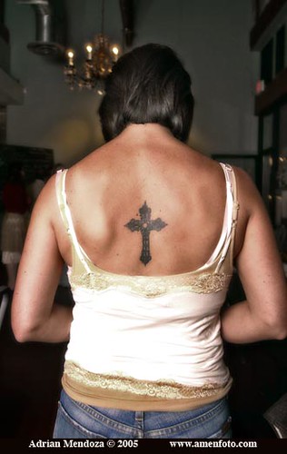 A woman displays her tattoo after dining in the Barkin Dog Grill on 11th 