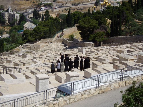 Jews perorming ritual a burial ground in Mount of Olives