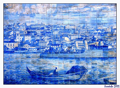 Fisherman on the river, looking at Alfama tile work