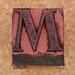 rubber stamp letter M