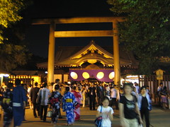 A kind of typical shot of a temple and people there for a festival