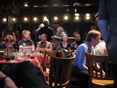People sitting at tables at St Urho’s Pub