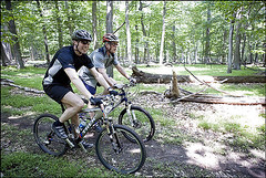  President George W. Bush (R) and Prime Minister Anders Fogh Rasmussen of Denmark navigate a path at Camp David, Maryland