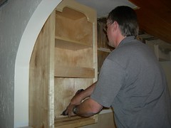 Putting in the first wall cabinet