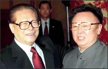 Kim Jong Il meets China's most powerful has-been (AP photo).