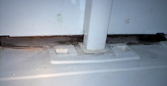 Frozen-over Condensate Drain Pan in a Whirlpool / Kenmore Top-Bottom Style Refrigerator.  Click for larger view.