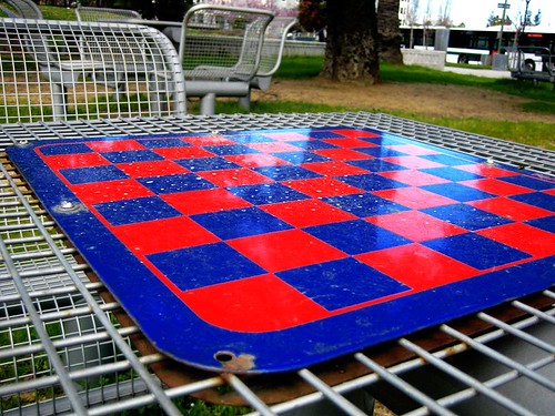 A chessboard awaits potential players in an Oakland park