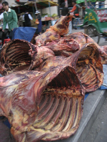 yak carcass on the sidewalk
