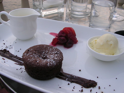 Warm Chocolate Truffle Cake with Candied Cherries, Manouri Ice Cream and Fresh Crème with Nutmeg