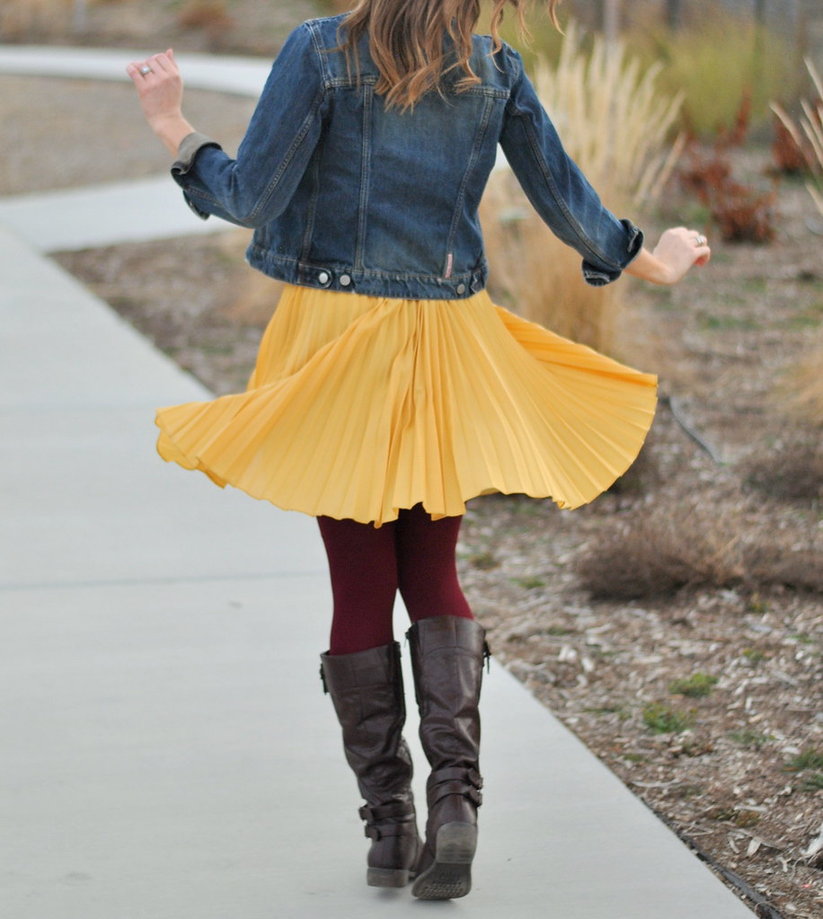 denim jacket + yellow skirt + maroon tights + boots