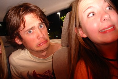 tyler and lizzy make faces in the car