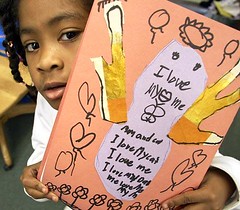 Martin Luther King Elementary School first-grader Dasia Burkett shows a project she made for her mom.
