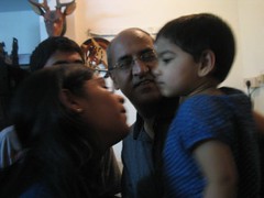 Giving Janani atthai a kiss while Babu thatha eagerly waits his turn