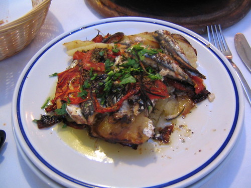 traditional meal of anchoives and potates with olive oil and other seasoning