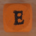 Coloured bead letter E