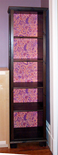 New bookcase w/ freshly papered back