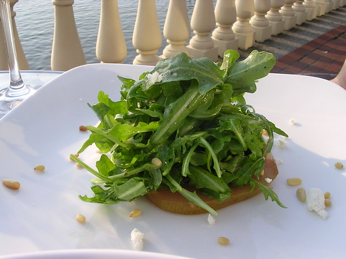 Arugula Salad with Wine-Poached Pears, Pine Nuts, Goat Cheese and Champagne Vinaigrette