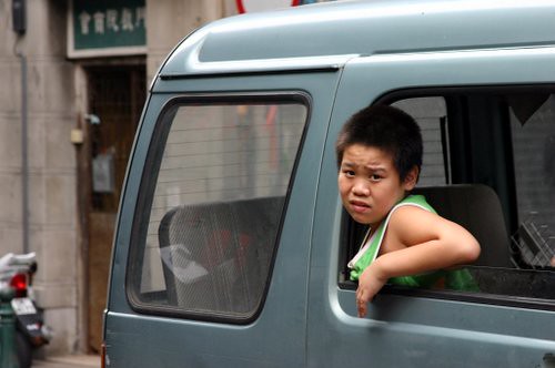 A boy in a car