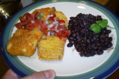 Cornmeal crusted tilapia with fresh salsa and spicy black beans
