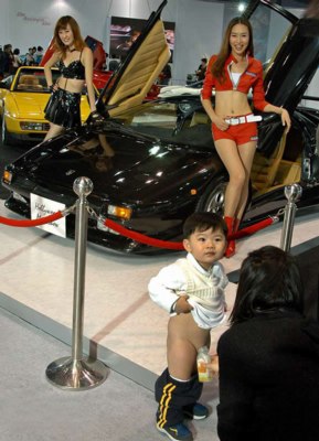 A Korean Boy Peeing In A Bottle In Front Of A Lamborghini