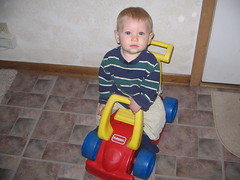 Benjamin riding his car