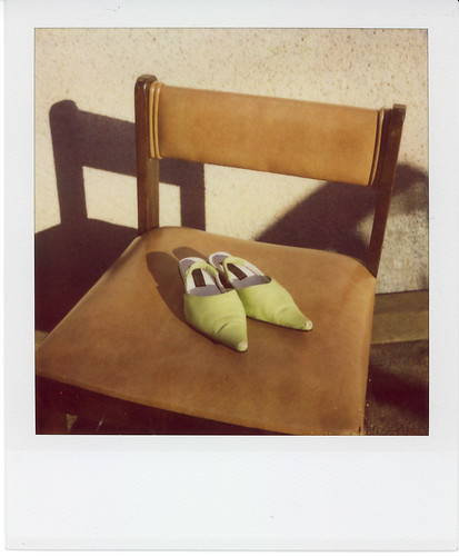 green shoes, brown chair