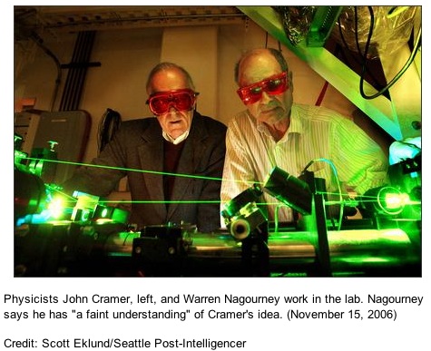 Physicists John Cramer, left, and Warren Nagourney work in the lab. Nagourney says he has 