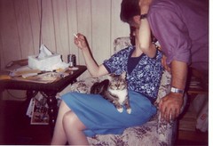 Mom and Dad, kissing. And Sweety, pretending to be what I was taking a picture of.