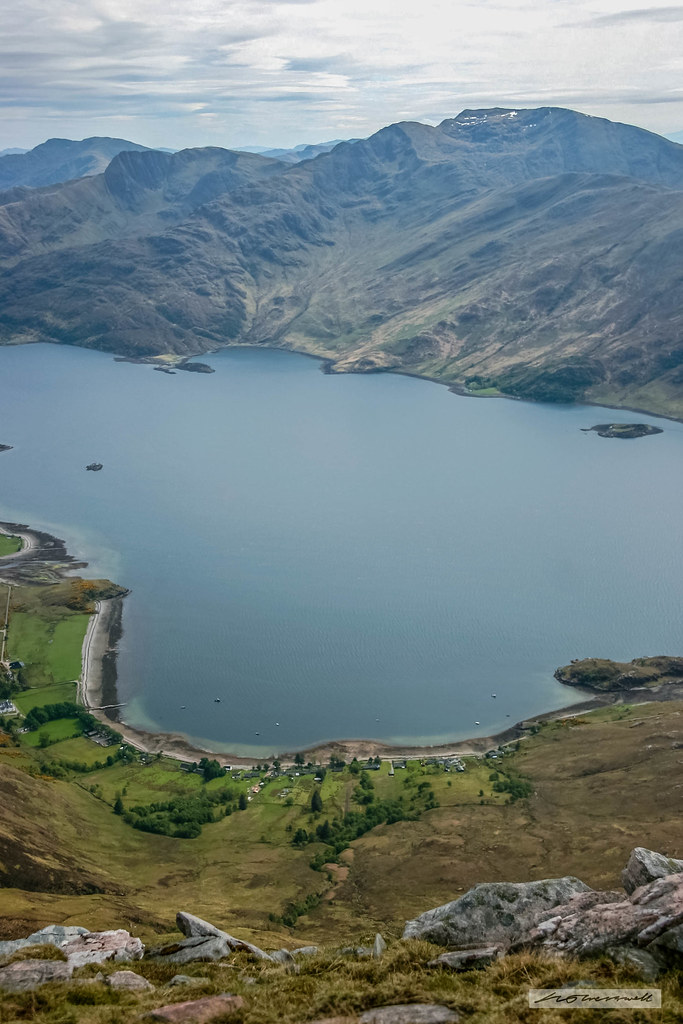 Ladhar Bheinn, Arnisdale village, the semi-circular bay of Camas Ban and Loch Hourn from Beinn Sgritheall (south).