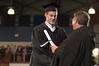 Receiving Diploma from President Fr. Jonathan DeFelice, O.S.B.