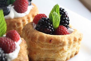 Fresh berries with puff pastry and coconut whipped cream
