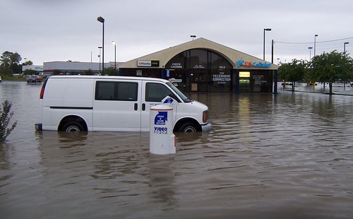 Van in flooded parking lot