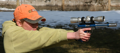 Cole shooting Blue gun w-scope