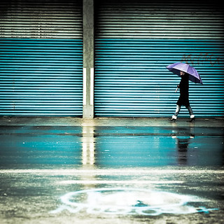 Blue / rain / reflection / urban / graffiti / umbrella / walking / woman / street photography