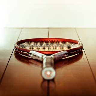 Lightroom red Head tennis racket reflecting on my wooden floor - Shot on my Nikon D3