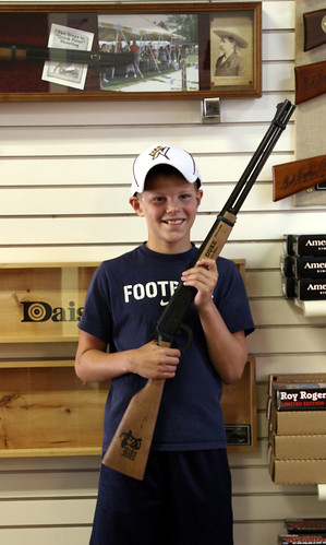 Boy holding Duke rifle