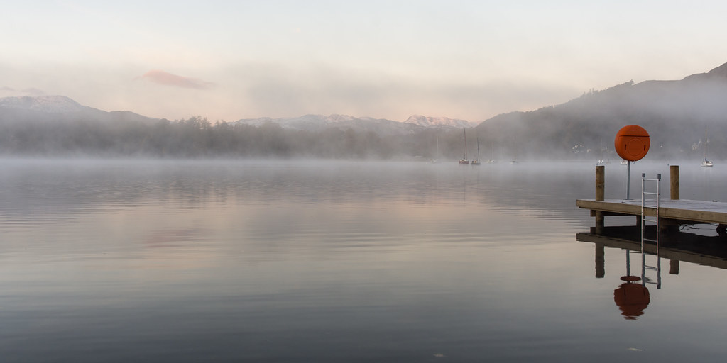 Misty autumn morning on Windermere lake
