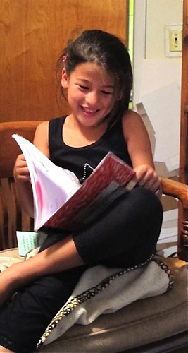 Carina reading her poetry in a poetry reading.    August 6, 2011
