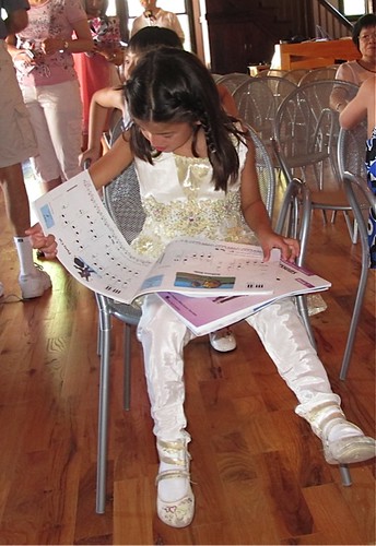 Carina studying the score prior to the performance on July 8, 2011